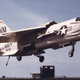 F-8J Crusader of VF-191 lands onboard USS Oriskany (CV 34). Note the raised wing which reduces landing speeds and improves pilot visibility. (US Navy)